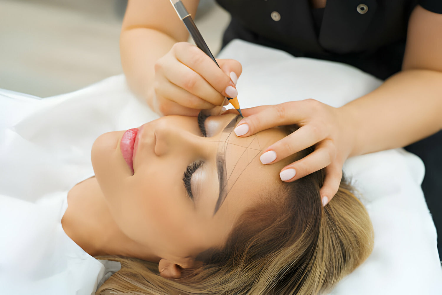 A client receiving a professional brow treatment